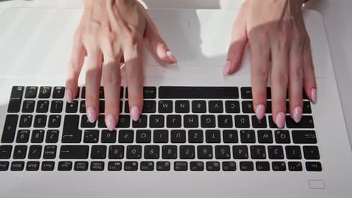 Close Up Woman Typing on Laptop Keyboard