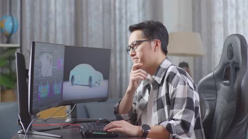 Man Working on 3D Car Design at Home