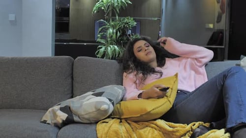 Couple bored videos. footage of extremely bored and frustrated couple sitting on a sofa at home stru
