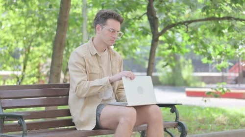 Man Leaving After Closing Laptop