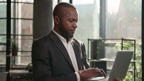 African American Businessman Ethnic Adult 40s Middleaged Business Man Stand with Laptop in Office