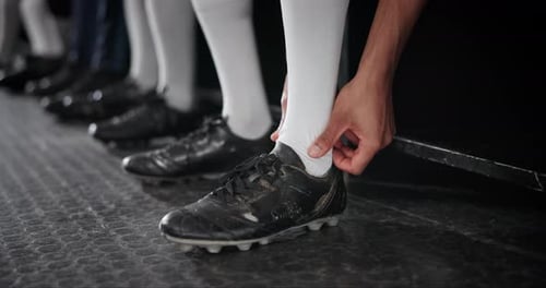 Football, locker room and man with massage of leg for sports injury, pain and swollen ankle