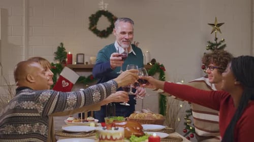 Diverse Family Celebrates Christmas Holiday Together with Toast