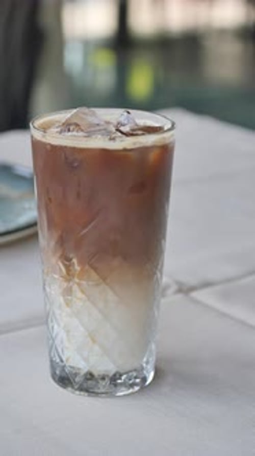 Refreshing iced latte served in elegant glass