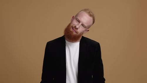 Bearded Man Puts on Boxing Gloves, Fighting Stance