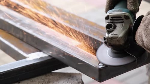 Metal Grinding Sparks Fly in Construction Close-Up