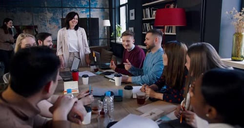 Happy Multiethnic Business People Brainstorm at Trendy Office Coworking Led By Successful Middle