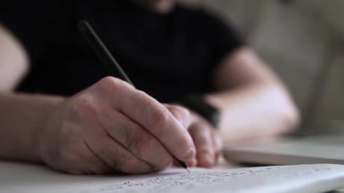 Creative Journaling: Man Working from Home Office