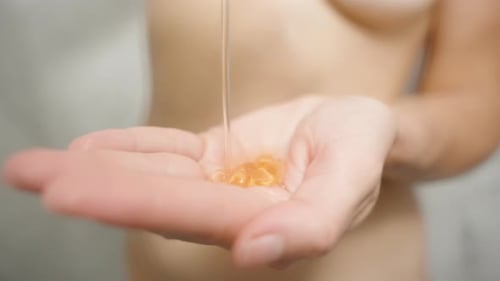 Amber Liquid Filling Hand in Close Up