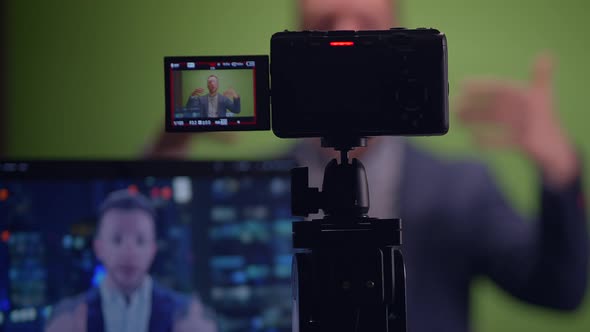 A Comprehensive Professional Video Recording Setup Featuring a Green ...