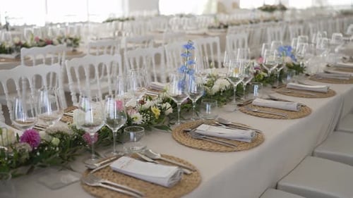 Elegant Wedding Reception Table Setting with Floral Decorations