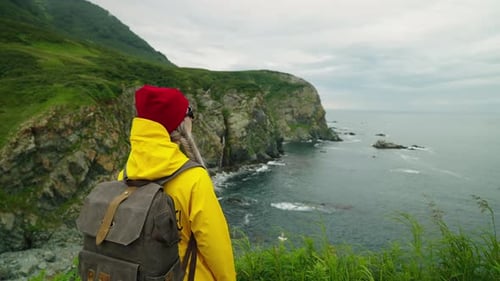 Woman Contemplating Beautiful Seaview From Edge Of Cliff Female Traveler Inspired By Ocean