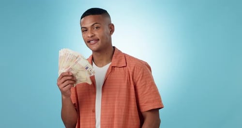 Money fan, cash and portrait of a man in studio as winner for competition, lottery or award