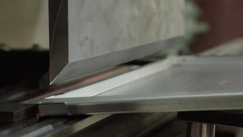 The Employee Hands are Not Bending the Large Parts of the Metal on the Bending Machine Closeup The