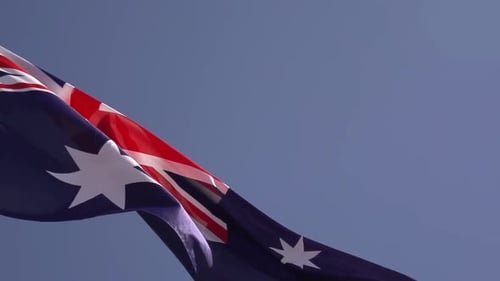 Australian Flag Waving Against a Blue Sky