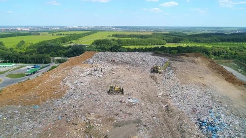 Aerial View of Large Garbage Landfill Trash Dump Flocks of Birds Circling Over the Garbage Dump