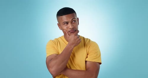 Thinking, brainstorming and young man in a studio with memory, reflection