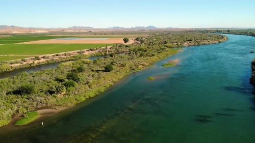 Spectacular Aerial View Of Winding River Flowing Through Lush Landscape