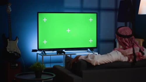 Man Watching News on Mockup TV
