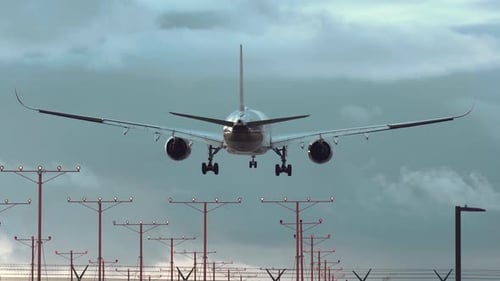 Jet airliner landing on runway.