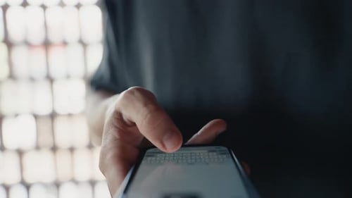 Person Texting and Typing on a Smartphone
