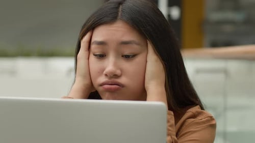 Exhausted Overworked Asian Woman Girl Student Studying Online Work on Laptop in Office Hold Head