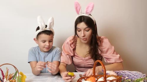 37. Mother, son and daughter are treated to an Easter chocolate egg. Celebrating Easter in the famil