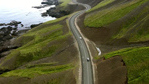 Aerial view of winding road near coast, Iceland.