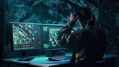 Military Soldier Operating Advanced Technology in a Command Center