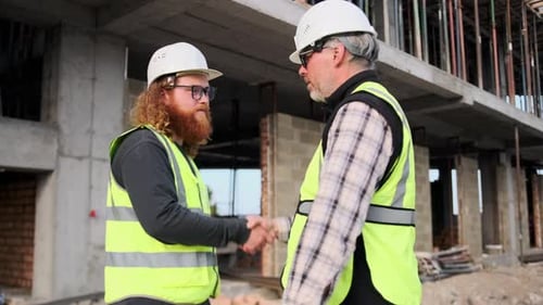 Meeting of two professional construction industry workers, shaking hands