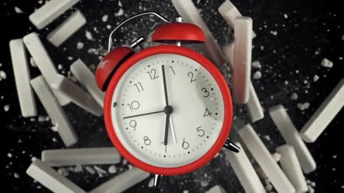 Alarm Clock and School Crayons Fly Up on a Black Background Filmed on a Highspeed Camera at 1000 Fps