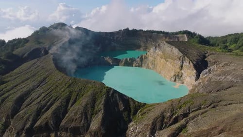 Aerial dron shot of the volcanic crater from Mount Kelimutu in Indonesia.