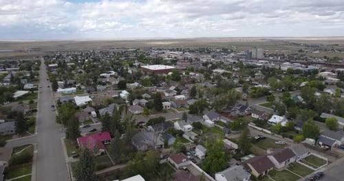 Cut Bank city main street and residential area rooftops from above, Montana