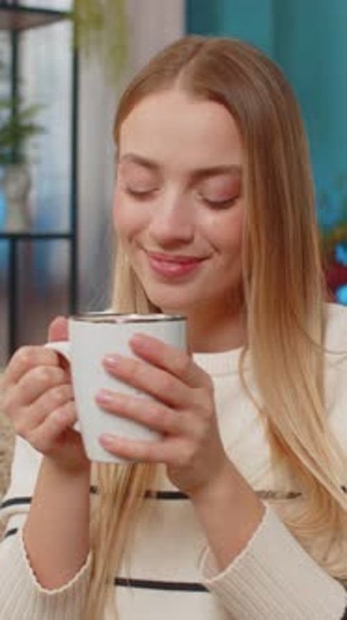 Woman Enjoying Morning Coffee in Living Room