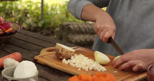 Chopping Vegetables on Wooden Board Outdoors
