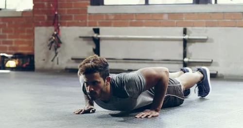 Gym, floor workout or man doing push up, sports fitness or bodybuilder for bicep strength
