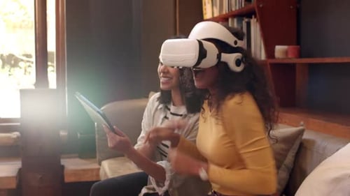 Woman Uses VR Headset with Friend on Tablet
