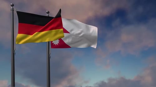 Germany and Bahrain National Flags Waving Against Blue Sky