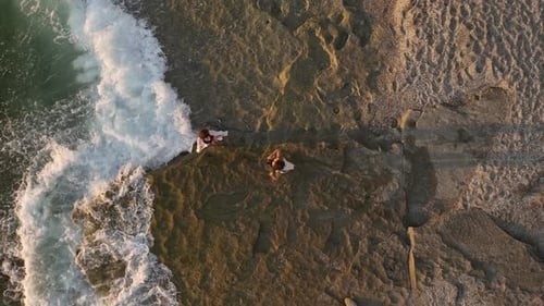 Aerial View The Sun Dips Into the Mediterranean Leaving Behind a Colorful Sky with Dramatic Clouds