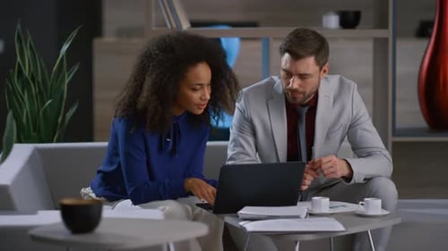 Diverse business team brainstorming corporate project in cafe coworking