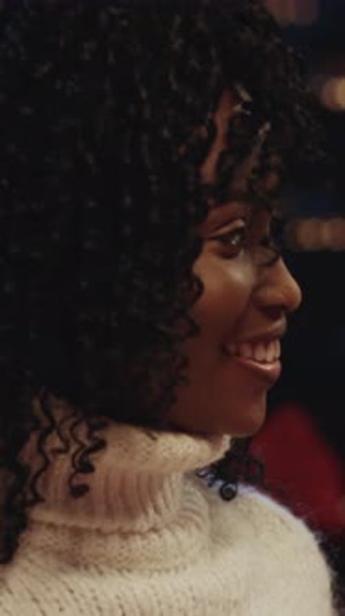 Smiling Woman in Turtleneck Close Up at Night