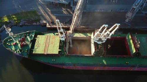 Aerial View Fom Above Wheat Loading to Bulker Ship Cargo Hold at Sea Grain Elevator in Sea Port