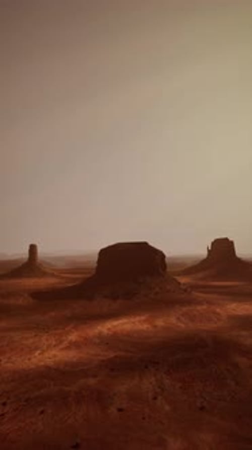 Barren Desert Landscape With Distant Rocks
