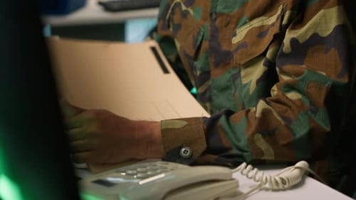 Military Soldier in Mission Control Center Answering Telephone Call