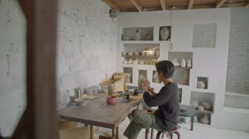 Artisan Making Ceramics in Pottery Studio