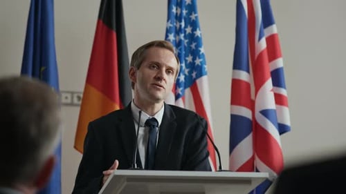 Public Speaker Discussing Global Issues at Political Summit