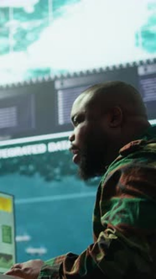 Man Working at Computer Analyzing Data