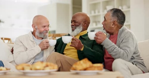 Three Senior Men Enjoying Coffee Together
