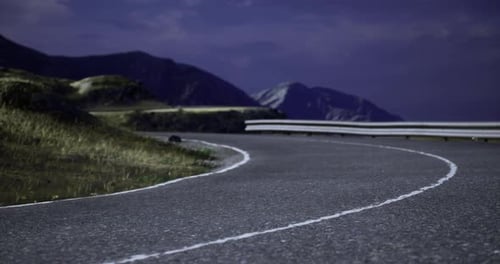 Curvy Mountain Road at Twilight with a Stunning Landscape