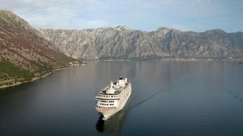 Large cruise ship passing through the picturesque bay of Kotor in Montenegro